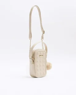 Beige quilted pom pom cross body bag