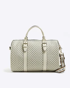 Beige RI monogram travel bag