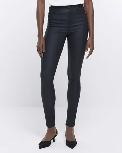 Black coated denim high waisted skinny jeans