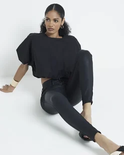 Black mid rise skinny coated jeans