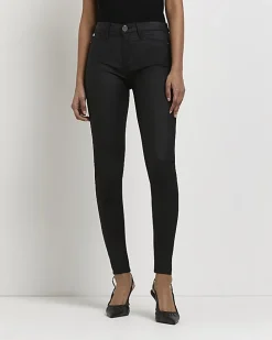 Black Molly coated mid rise skinny jeans