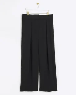 Black pleated wide leg trousers