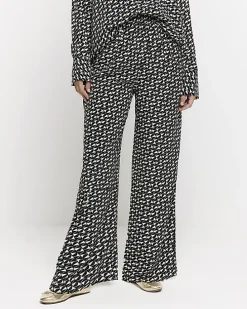 Black satin geometric wide leg trousers