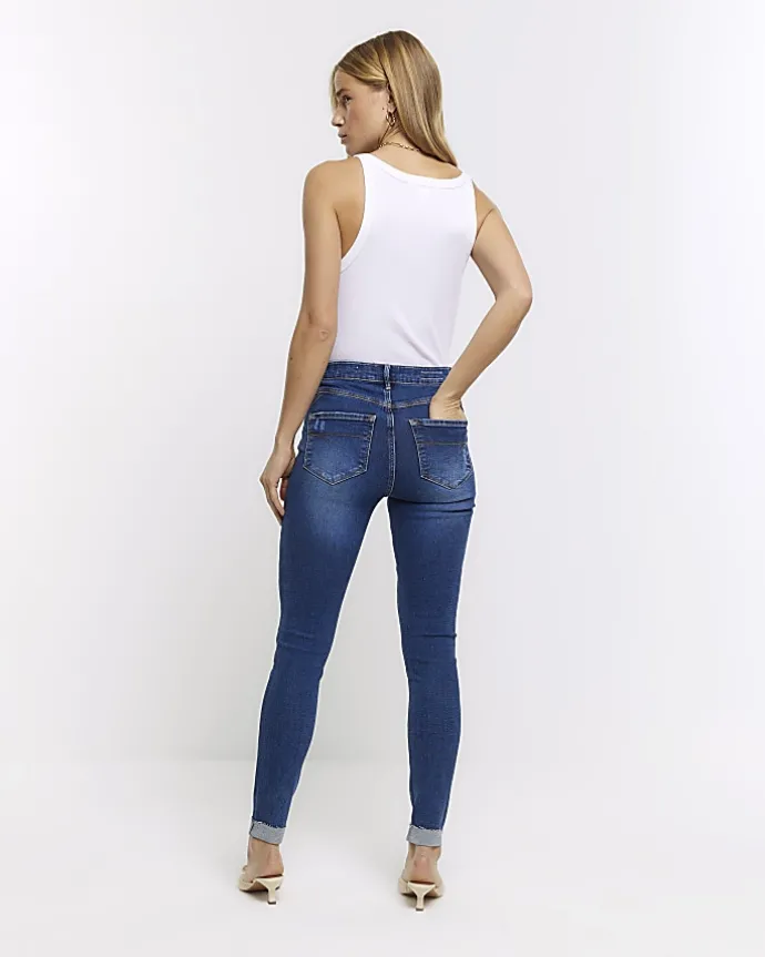 Blue mid rise bum sculpt patch skinny jeans