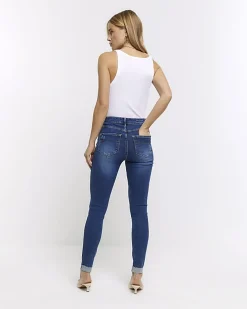 Blue mid rise bum sculpt patch skinny jeans