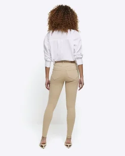 Cream mid rise bum sculpt jeggings