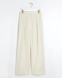 Cream pleated wide leg trousers