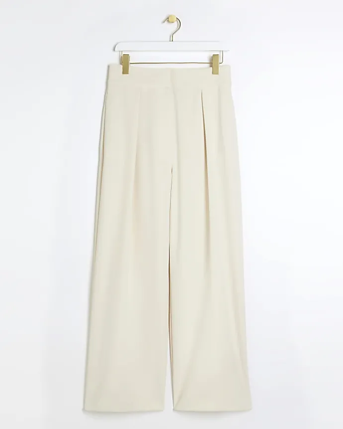 Cream pleated wide leg trousers