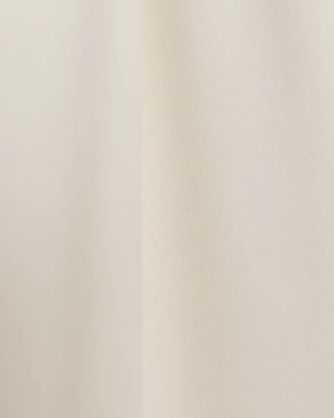 Cream pleated wide leg trousers