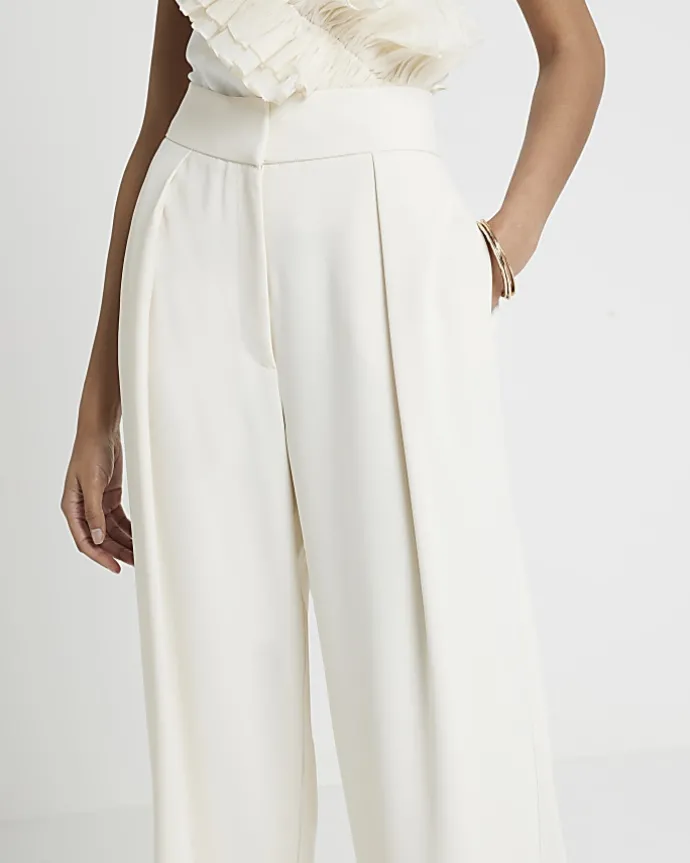Cream pleated wide leg trousers