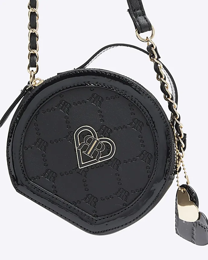 Girls black circle embossed cross body bag