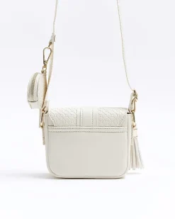 Girls cream embossed monogram cross body bag