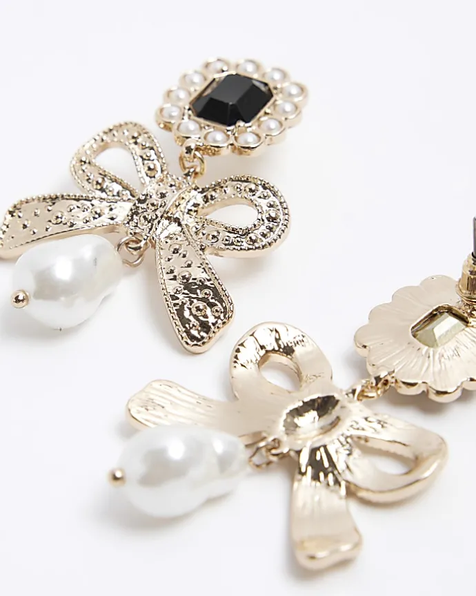 Gold pearl bow drop earrings