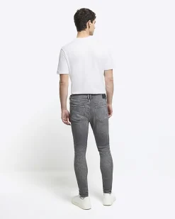 Grey super skinny spray on faded jeans