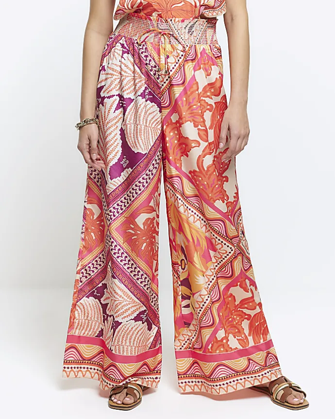 Orange floral wide leg trousers