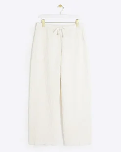 Petite cream textured wide leg trousers