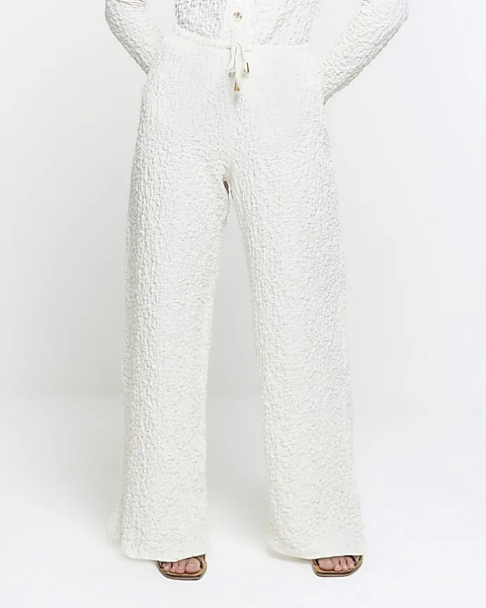 Petite cream textured wide leg trousers