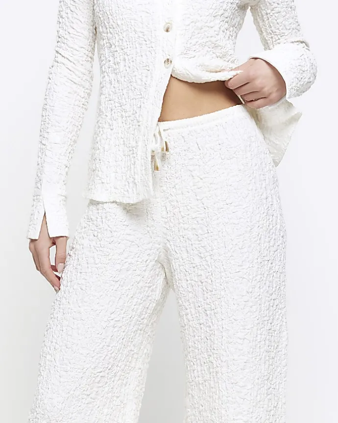 Petite cream textured wide leg trousers