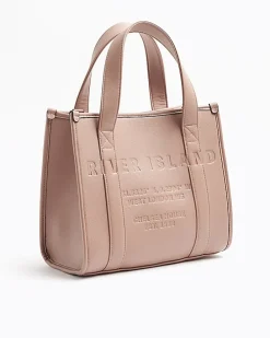Pink embossed cross body tote bag