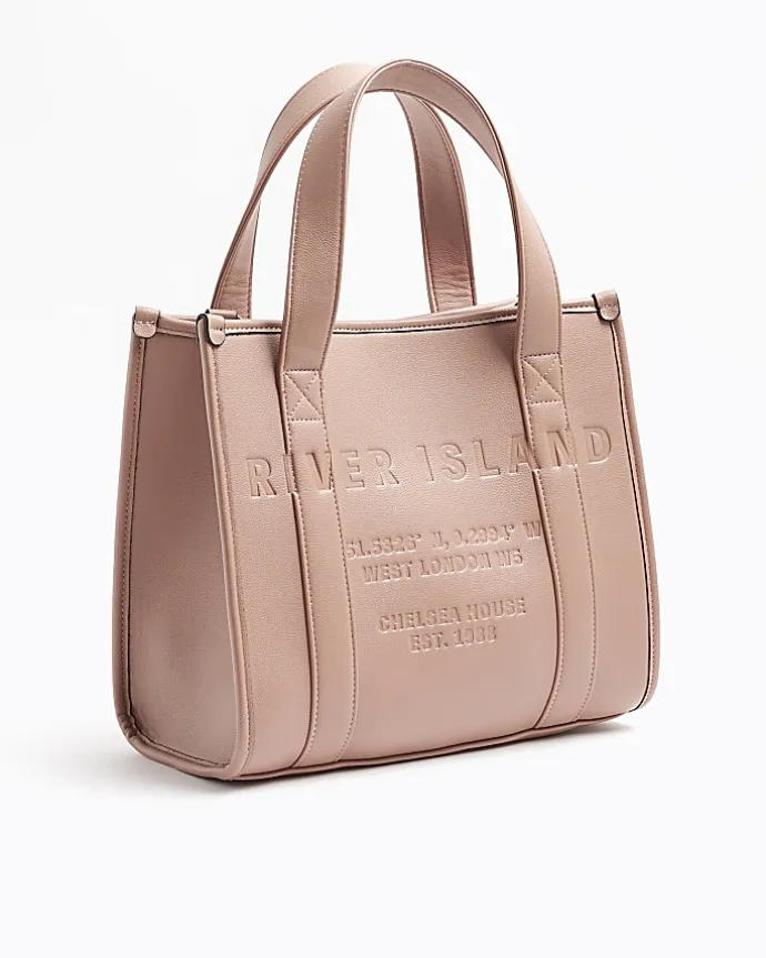 Pink embossed cross body tote bag