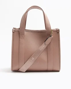 Pink embossed cross body tote bag