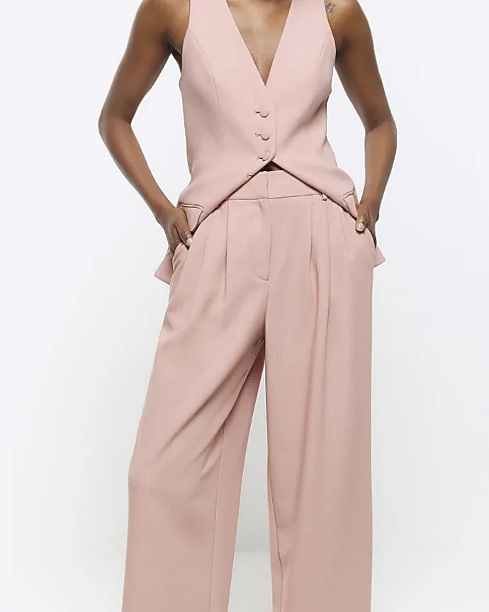 Pink pleated wide leg trousers