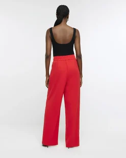Red pleated wide leg trousers