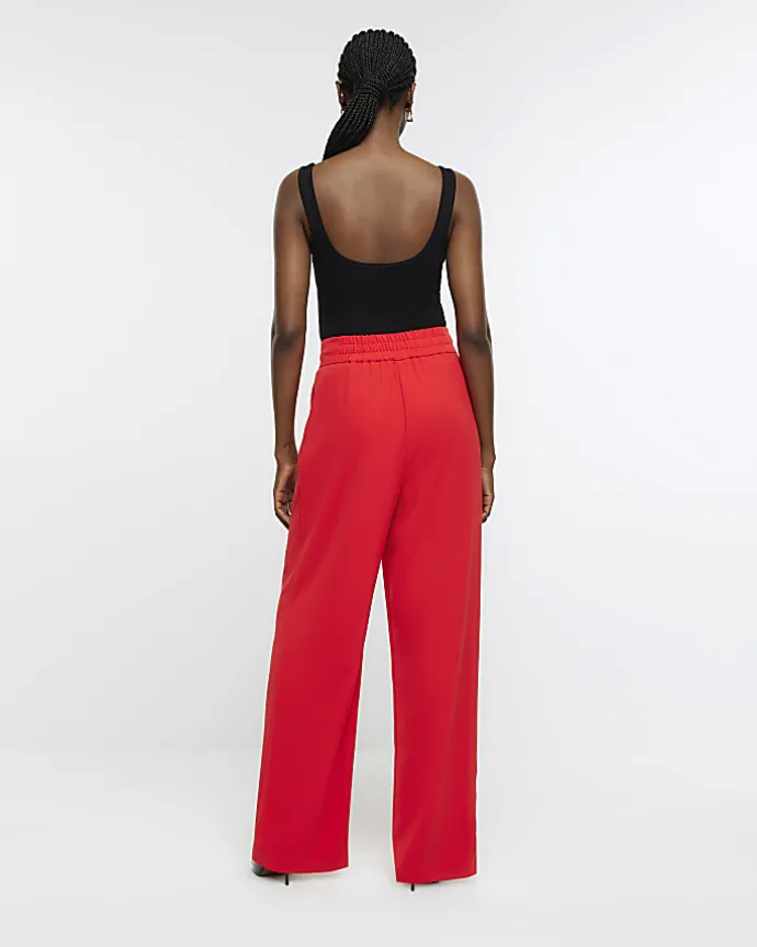 Red pleated wide leg trousers
