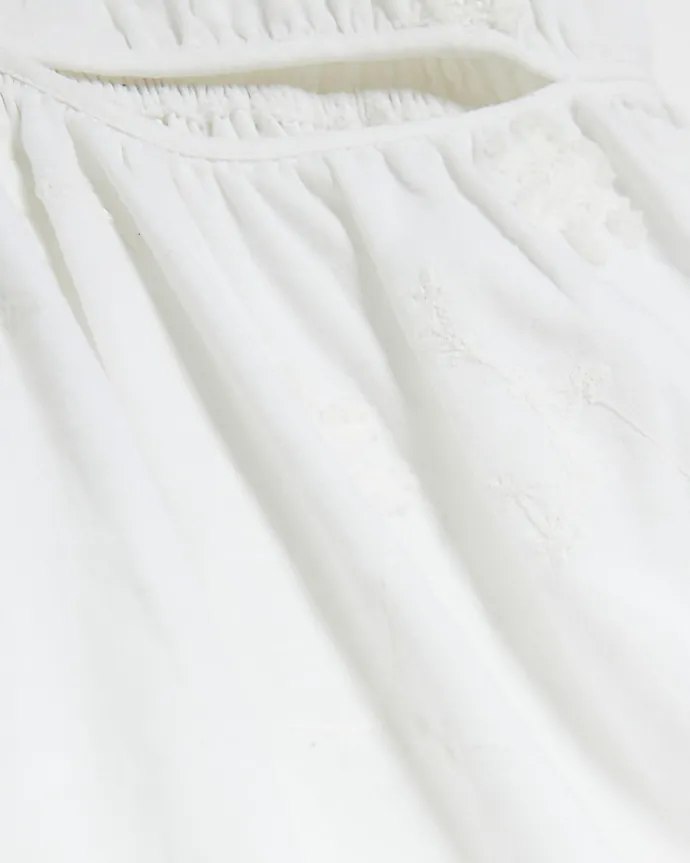 White textured cut out playsuit