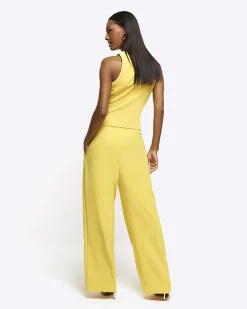 Yellow pleated wide leg trousers