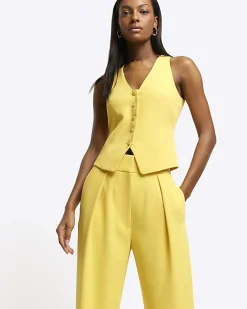 Yellow pleated wide leg trousers